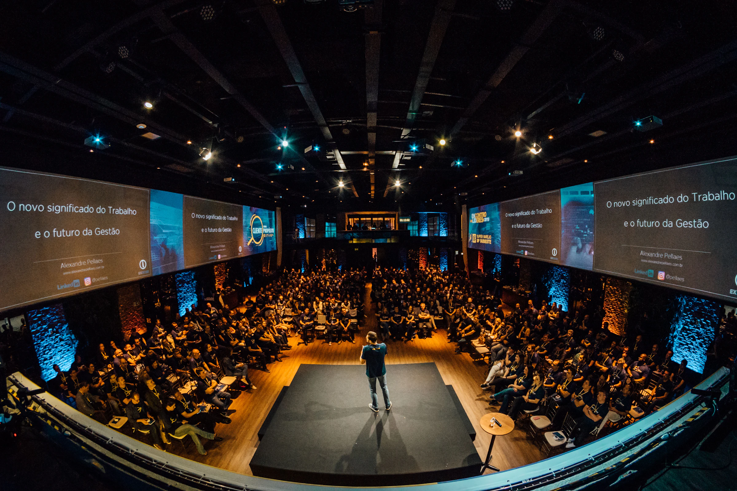 Executive speaker addressing a large live audience